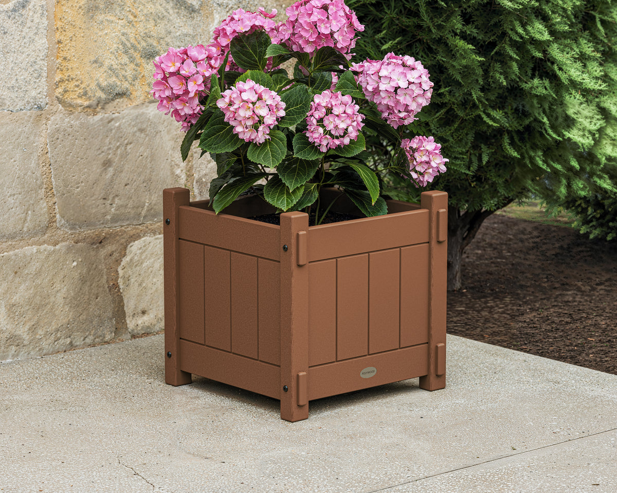 POLYWOOD Vineyard Square Planter Box in Teak in an outdoor setting