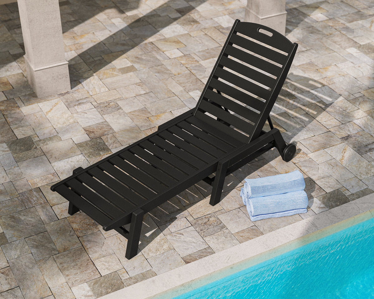 Lifestyle photo of the POLYWOOD Nautical Chaise with Wheels in Black