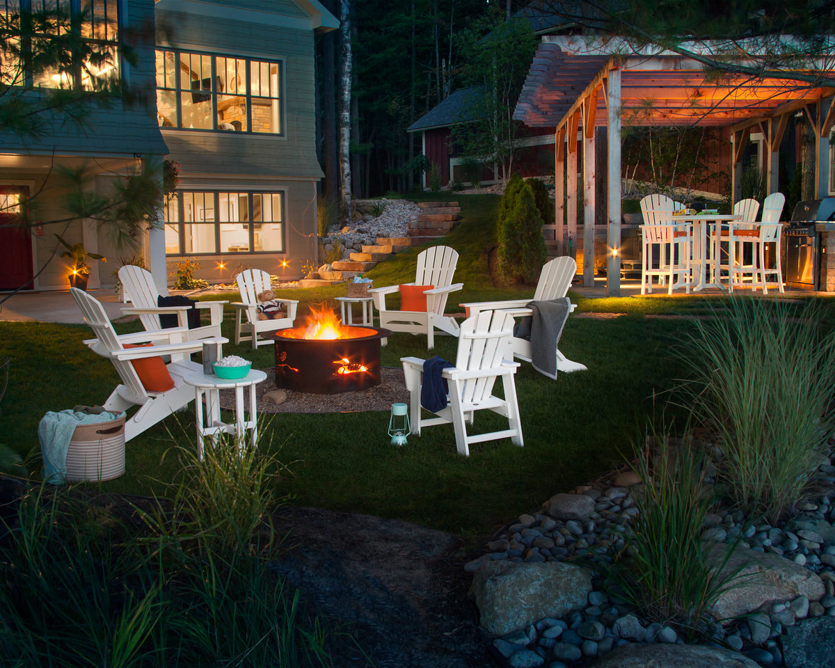 POLYWOOD Palm Coast Folding Adirondack in White in an outdoor setting