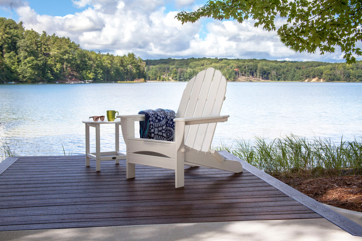 POLYWOOD Classic Oversized Folding Adirondack Chair in White styled outdoors