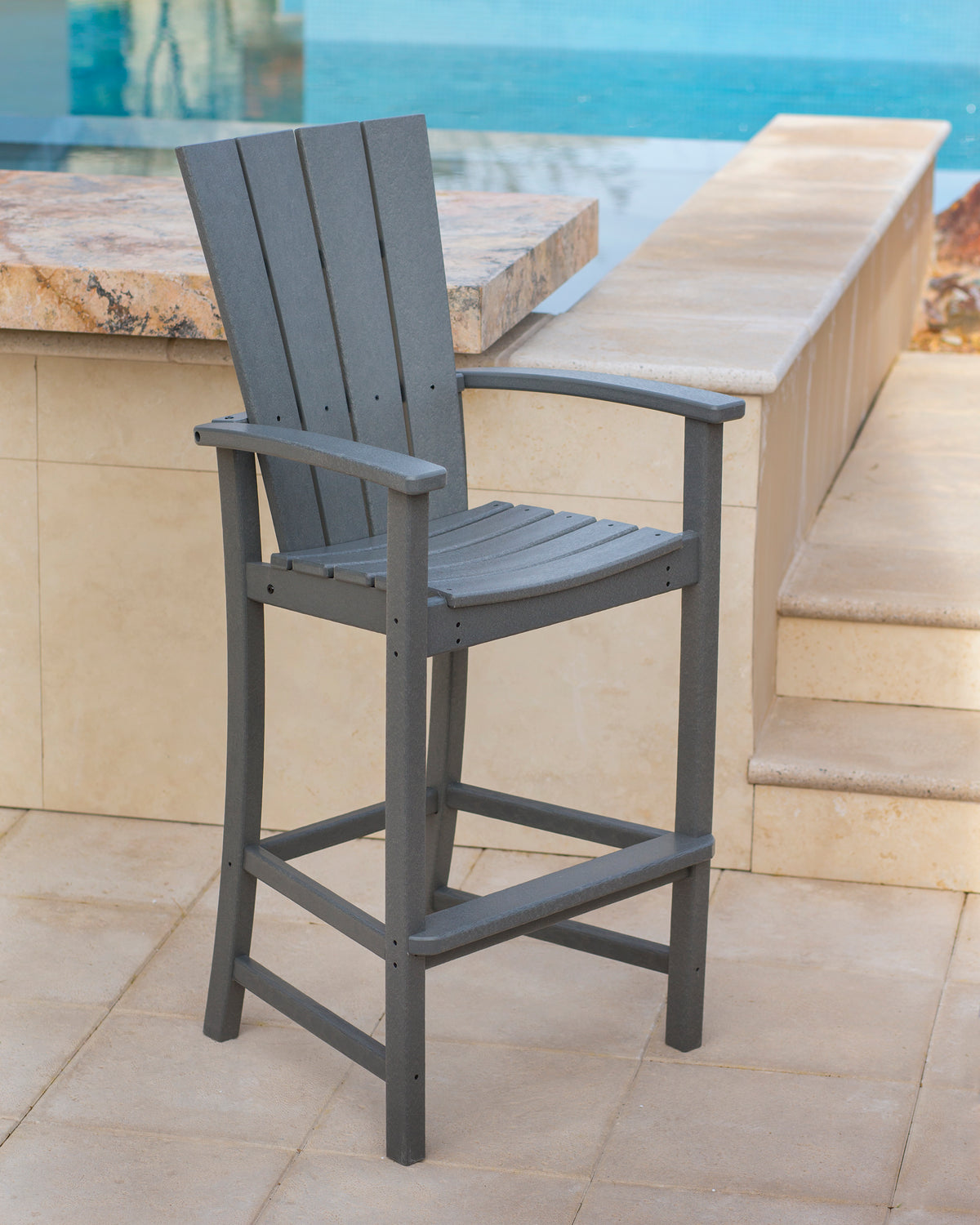 POLYWOOD Quattro Adirondack Bar Chair in Slate Grey in an outdoor setting