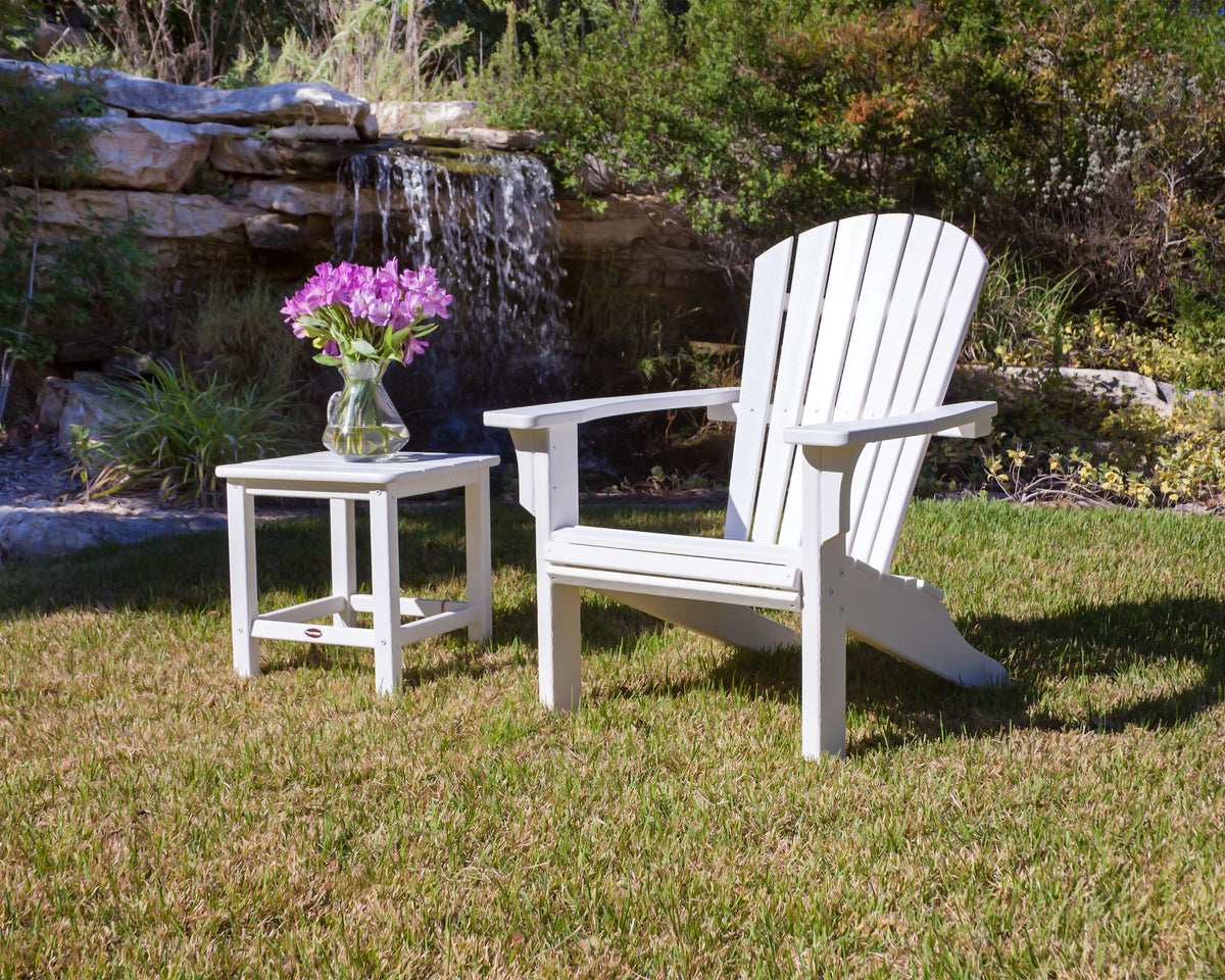 Lifestyle photo of the POLYWOOD Seashell Adirondack in White