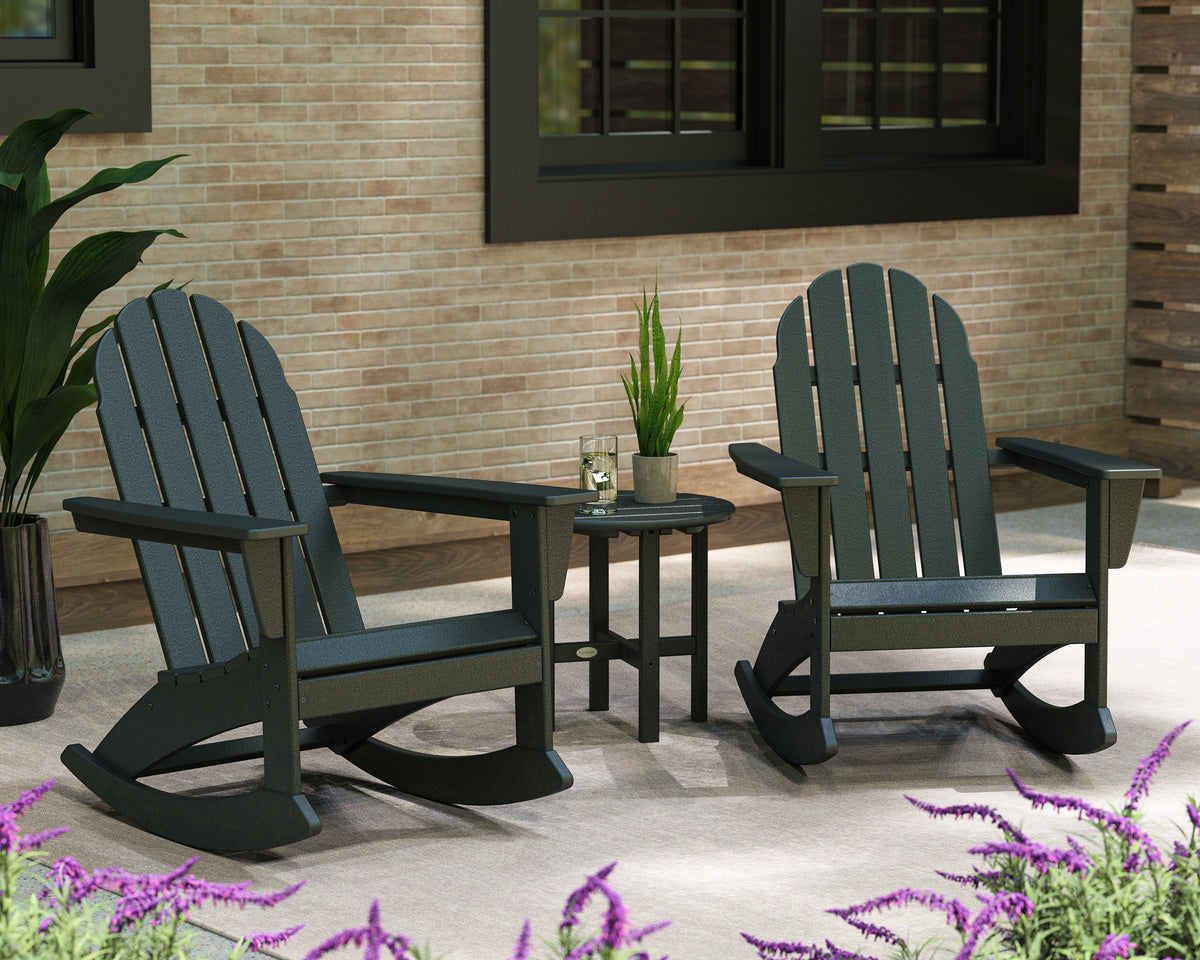 Lifestyle photo of the POLYWOOD Vineyard 3-Piece Adirondack Rocking Chair Set with 18" Round Table in Black