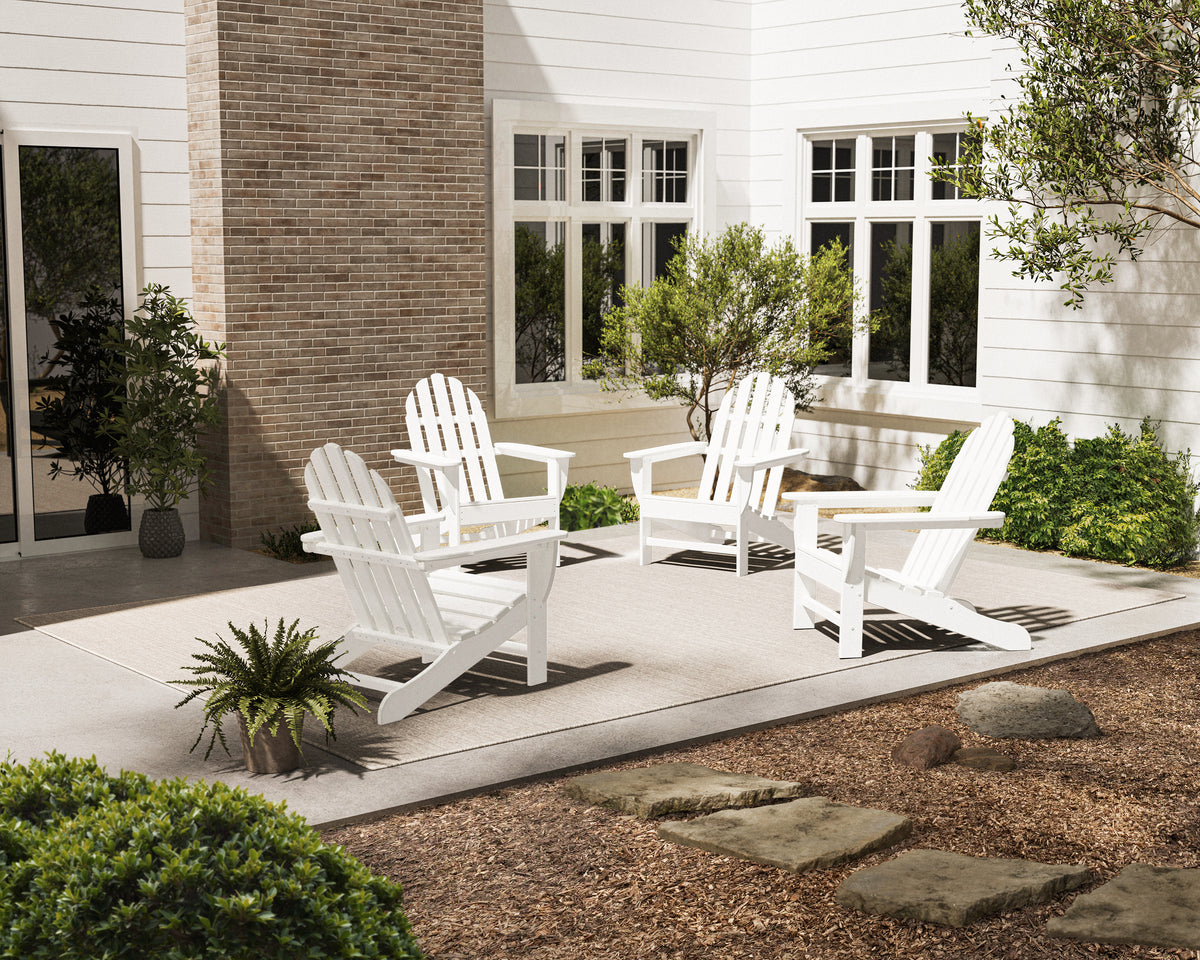 Lifestyle photo of the POLYWOOD 4-Piece Classic Adirondack Conversation Set in White
