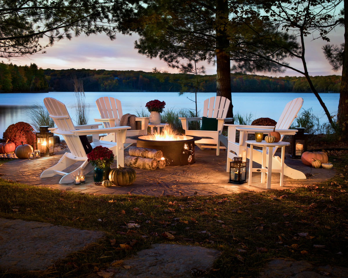 Lifestyle photo of the POLYWOOD Palm Coast Folding Adirondack in White