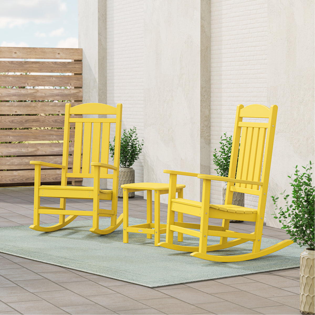 Lifestyle photo of the POLYWOOD Presidential 3-Piece Rocking Chair Set with 18" South Beach Side Table in Lemon