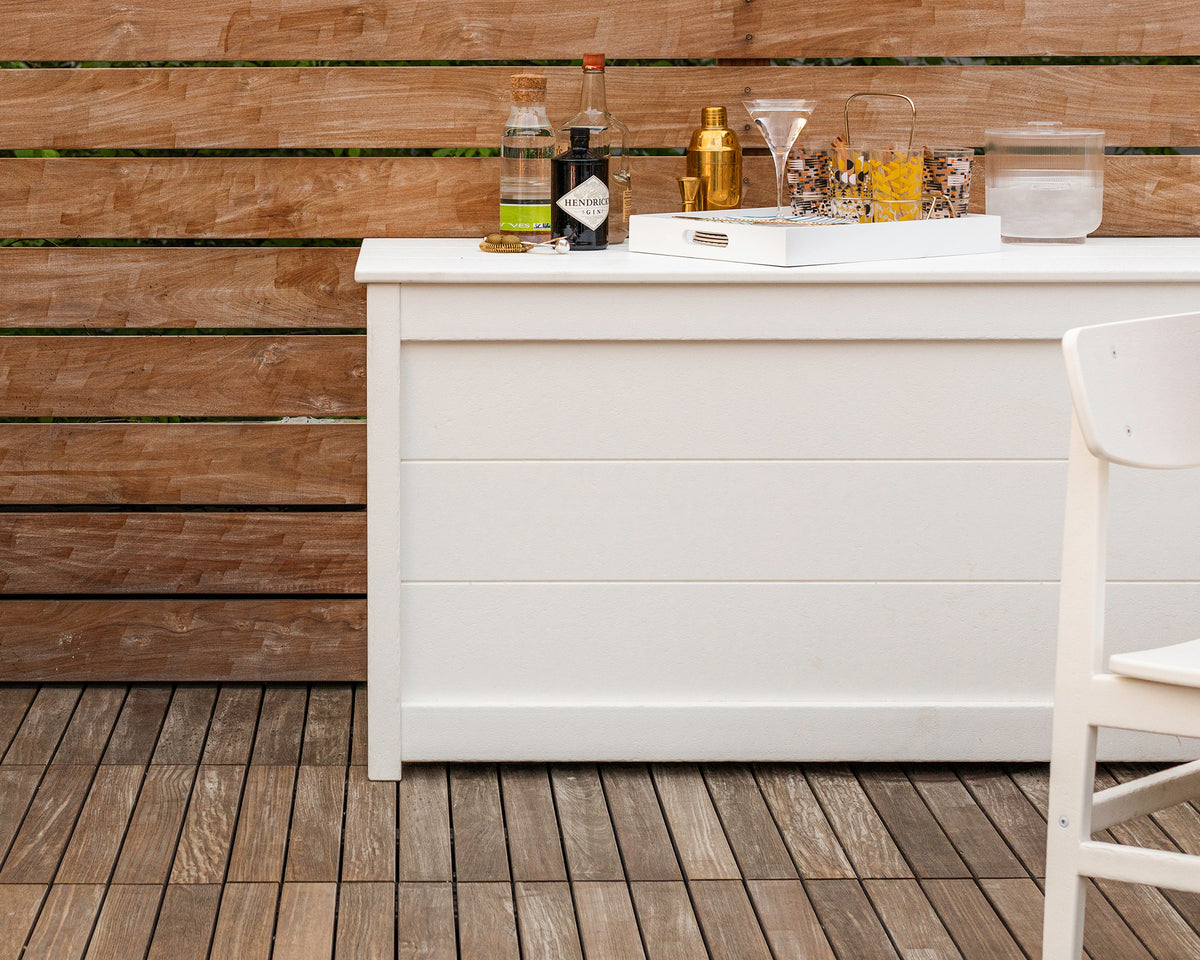POLYWOOD 68" Storage Box Table in White in an outdoor setting