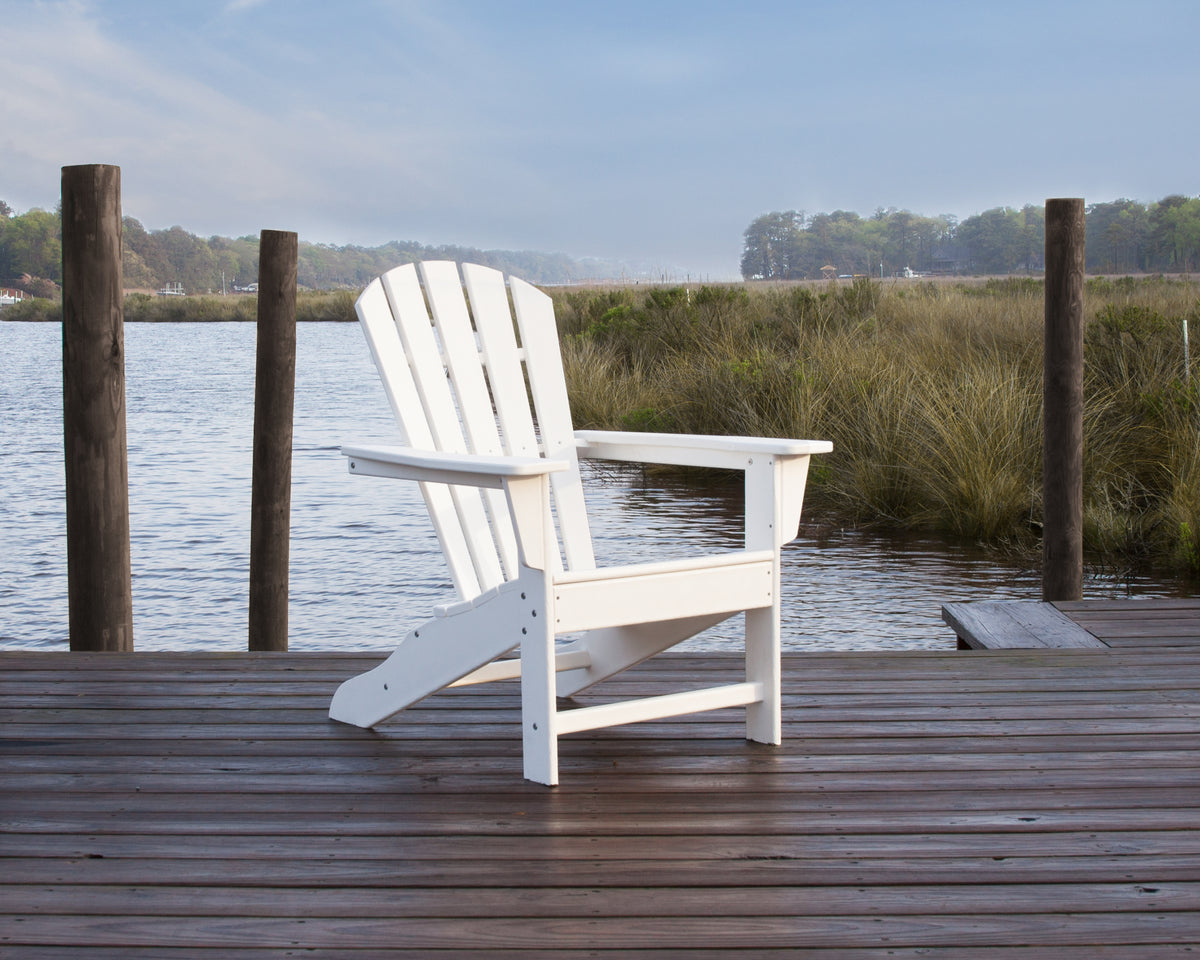 POLYWOOD Palm Coast Adirondack Chair in White in an outdoor setting