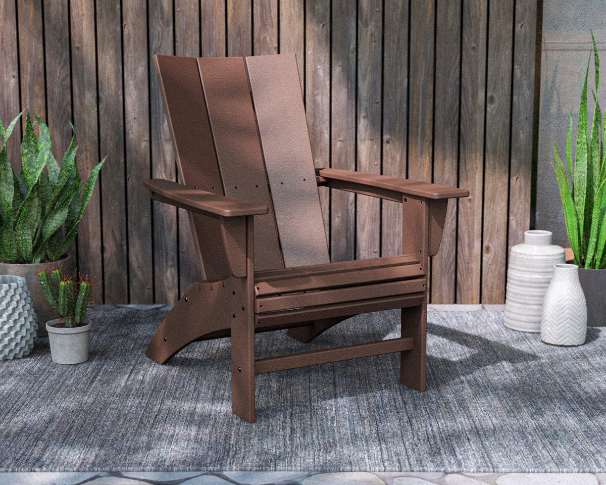 POLYWOOD Modern Curveback Adirondack Chair in Mahogany in an outdoor setting