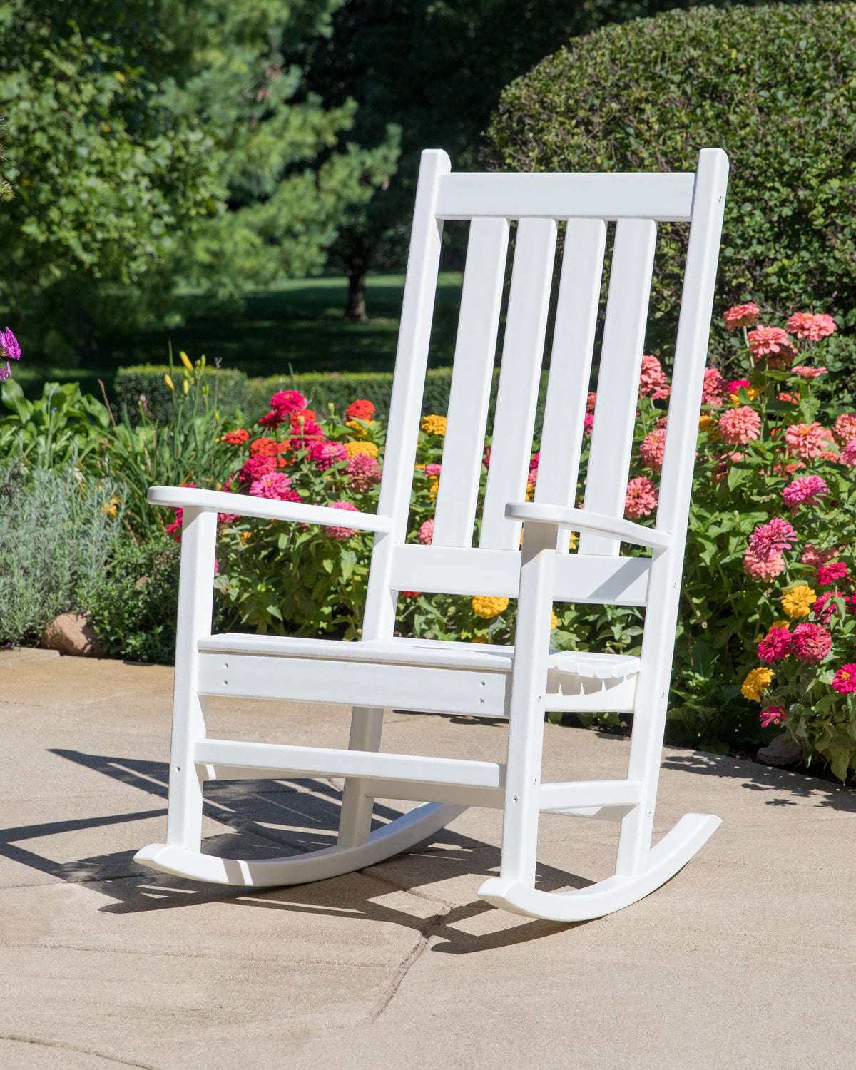 POLYWOOD Vineyard Porch Rocking Chair in White in an outdoor setting