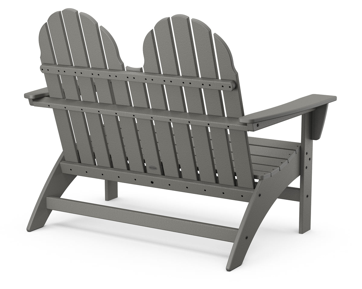 Angled front view of the POLYWOOD Vineyard 48" Adirondack Bench in Slate Grey