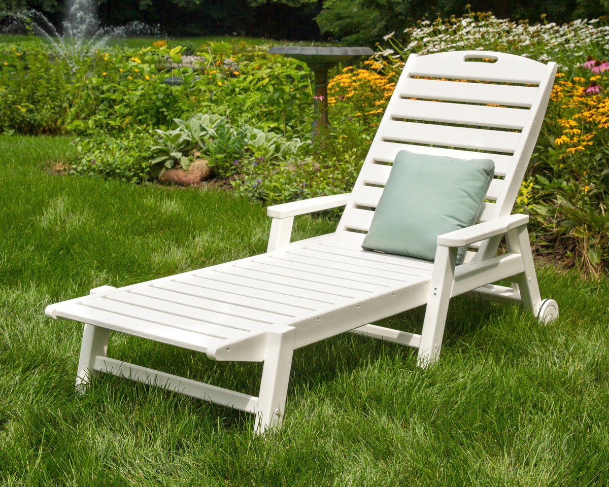 Lifestyle photo of the POLYWOOD Nautical Chaise with Arms & Wheels in White