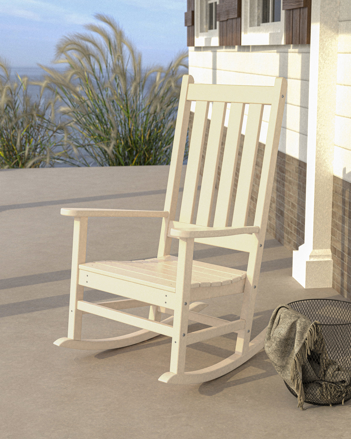 POLYWOOD Vineyard Porch Rocking Chair in Sand in an outdoor setting