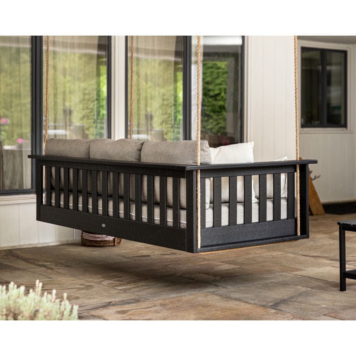 Lifestyle photo of the POLYWOOD Vineyard Daybed Swing