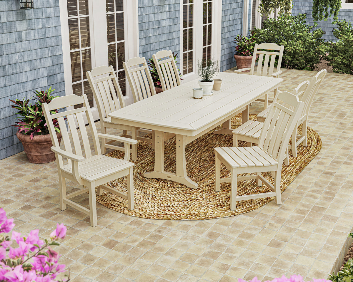 Lifestyle photo of the POLYWOOD Cottage 9-Piece Dining Set with Trestle Legs