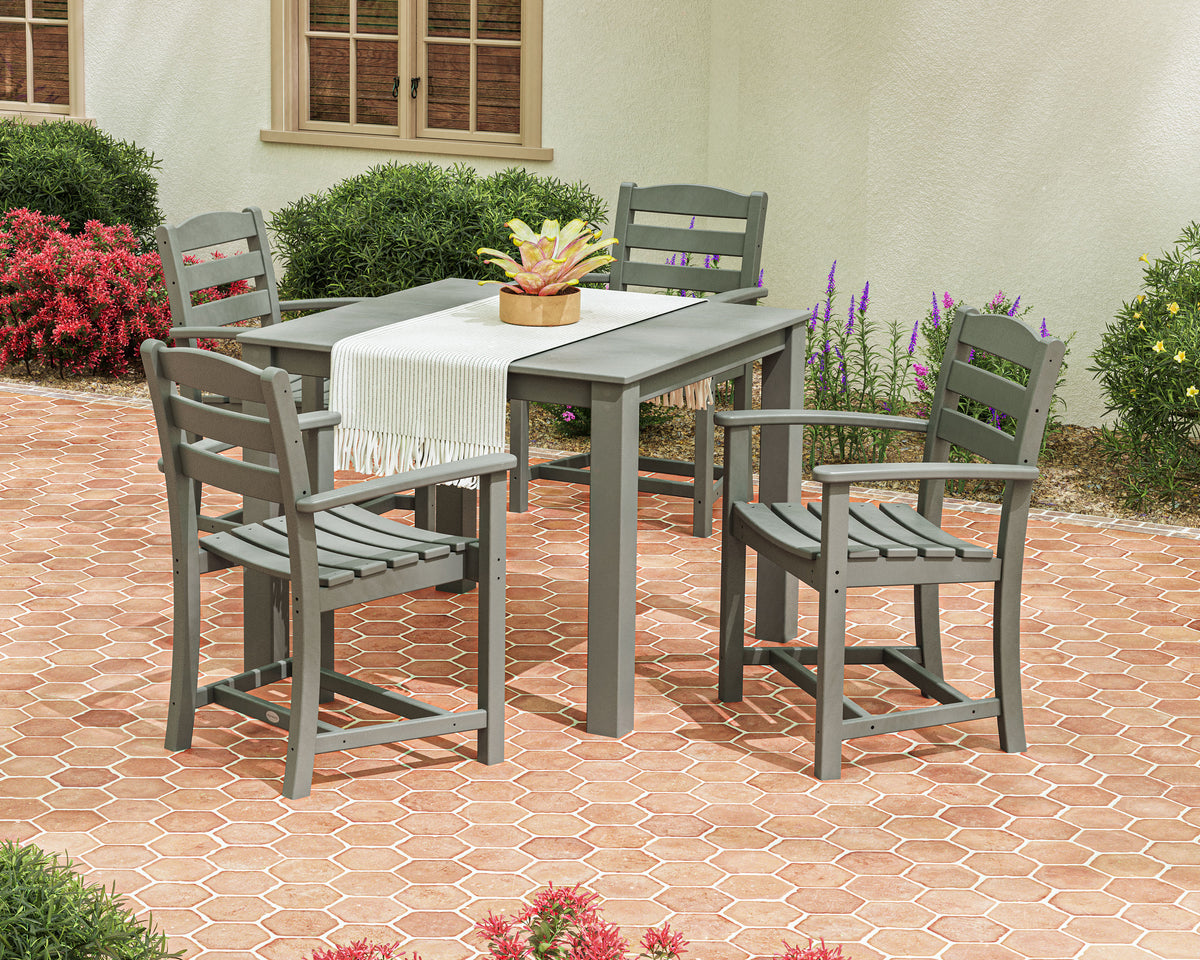 Lifestyle photo of the POLYWOOD La Casa Café 5-Piece Parsons Dining Set