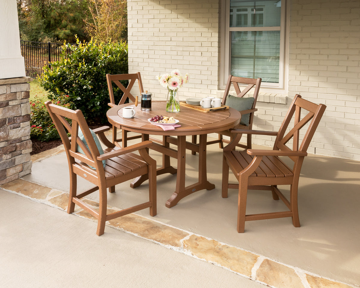 Lifestyle photo of the POLYWOOD Braxton 5-Piece Nautical Trestle Arm Chair Dining Set