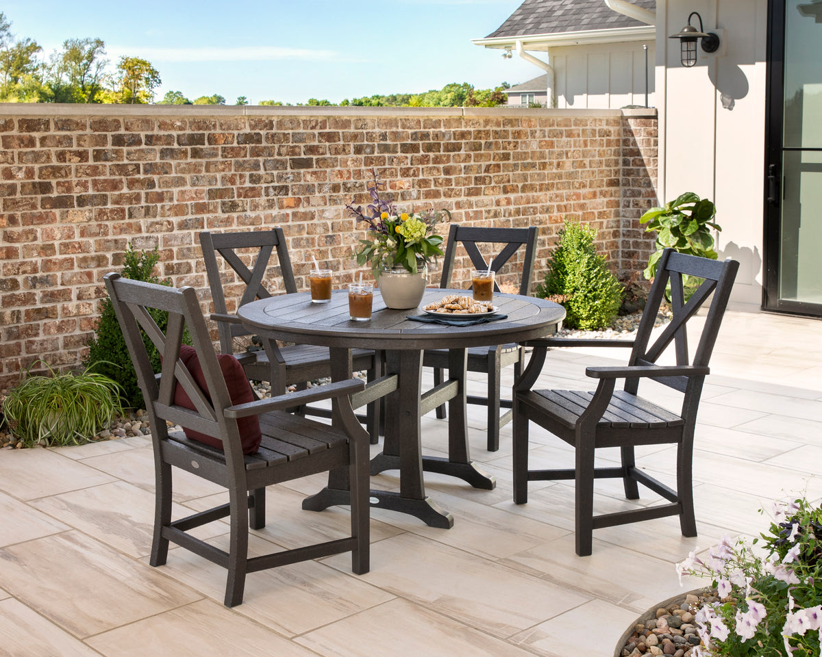 Lifestyle photo of the POLYWOOD Braxton 5-Piece Nautical Trestle Arm Chair Dining Set