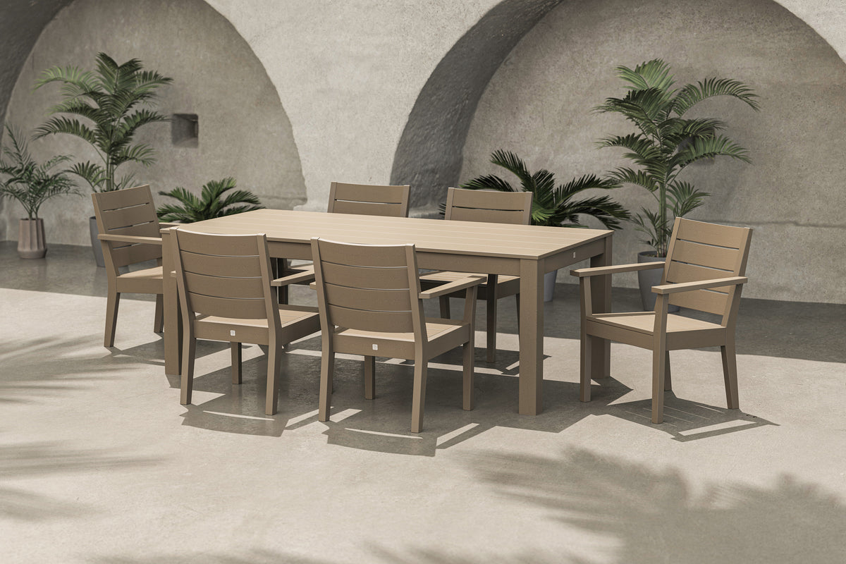 Lifestyle photo of the POLYWOOD Latitude 7-Piece Arm Chair Dining Set - 84" Table