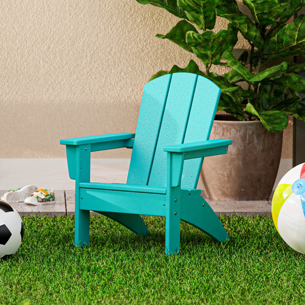 Lifestyle photo of the POLYWOOD Kids Nautical Adirondack Chair in Aruba