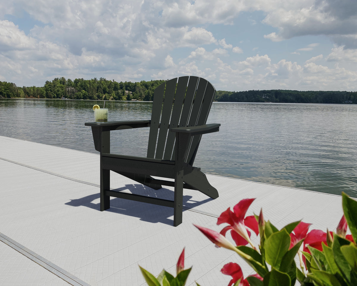 Lifestyle photo of the POLYWOOD South Beach Adirondack in Black