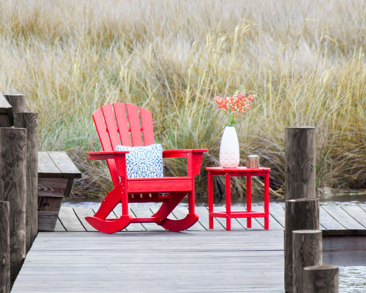 POLYWOOD Palm Coast Adirondack Rocking Chair in Sunset Red in an outdoor setting