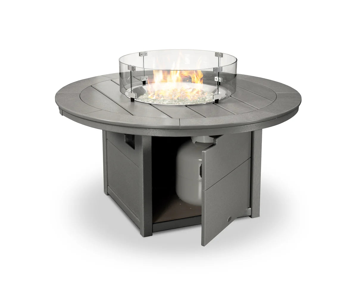 Round outdoor fire table with glass cover on a white background