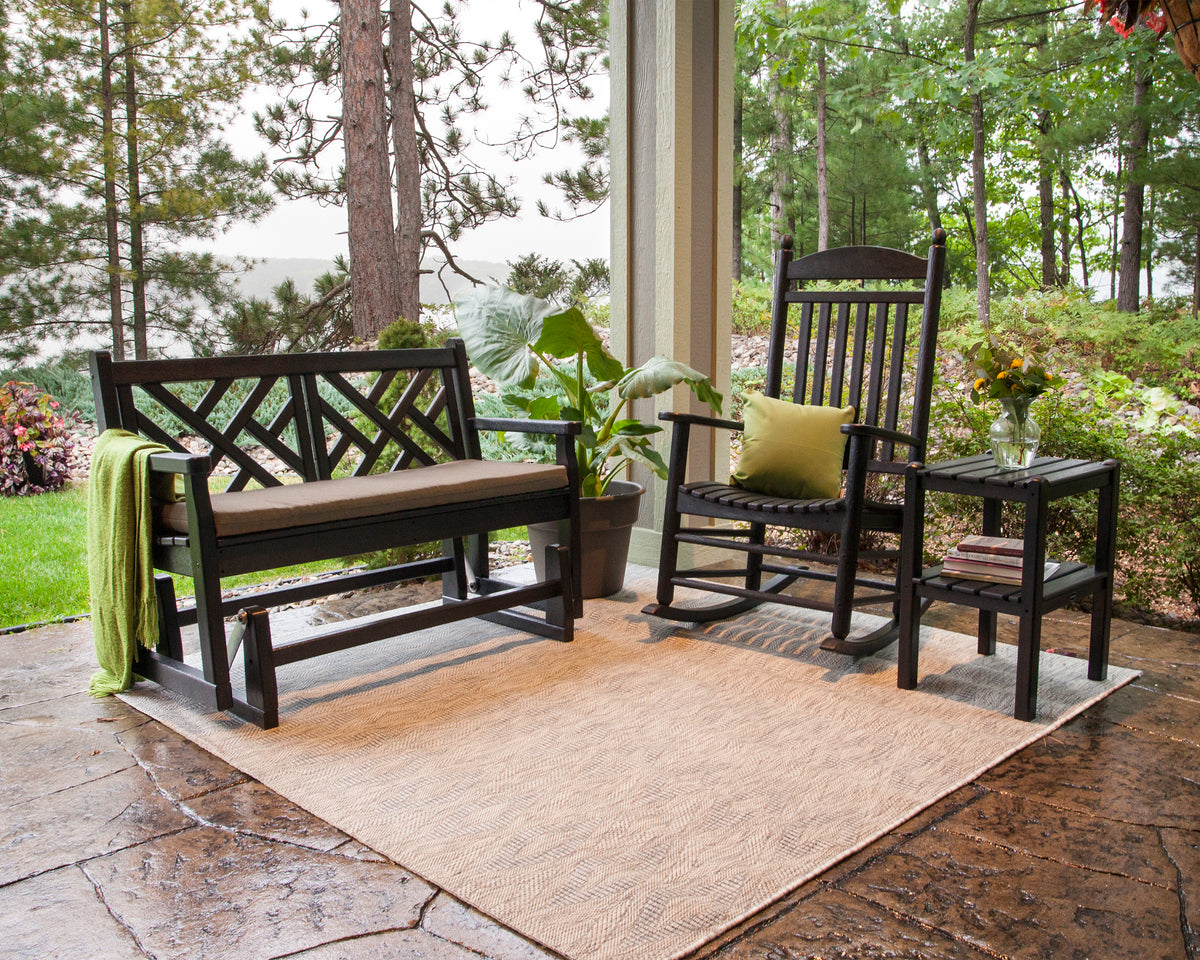 POLYWOOD Chippendale 48" Glider in Black in an outdoor setting