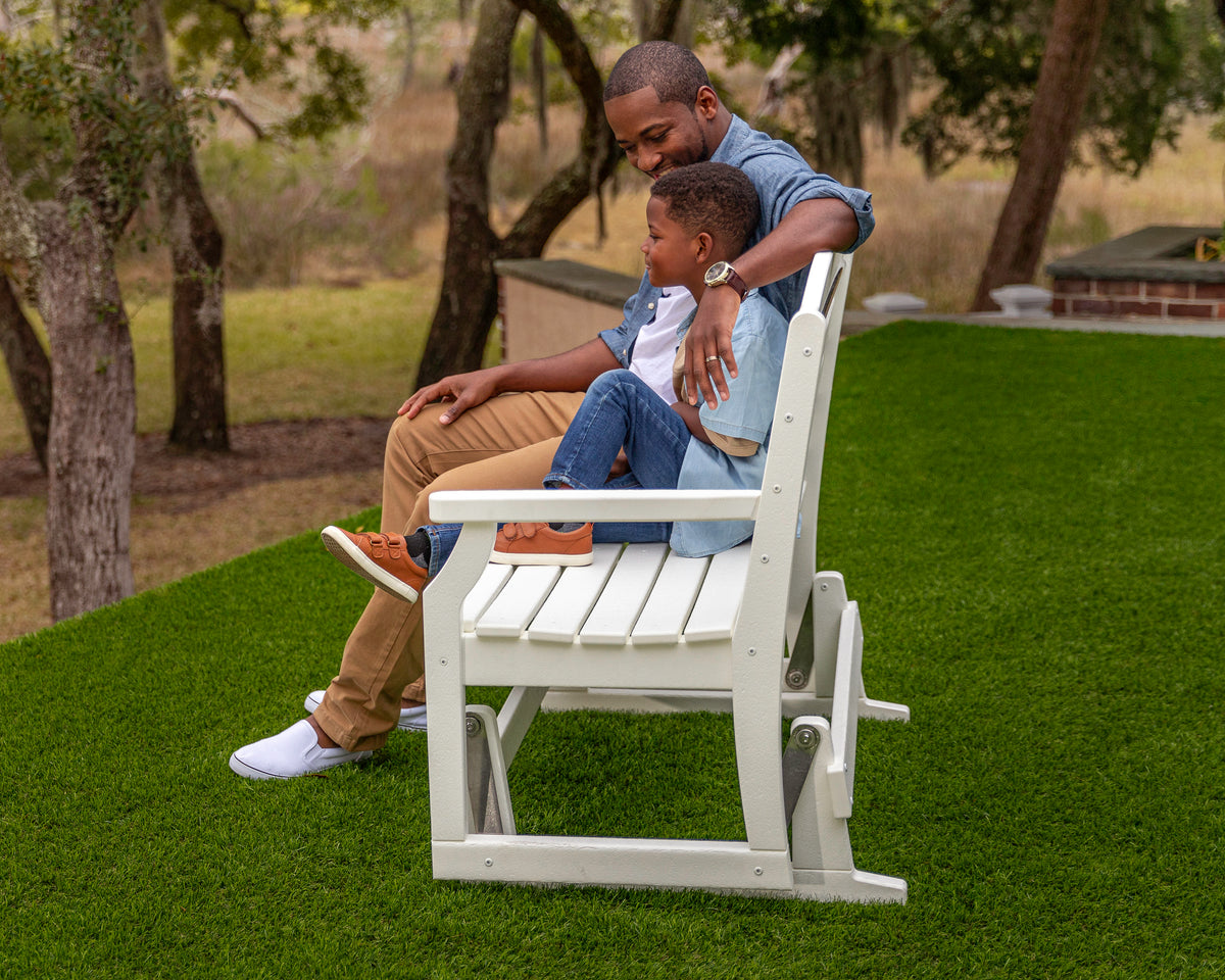 POLYWOOD Savannah 48" Glider in White in an outdoor setting