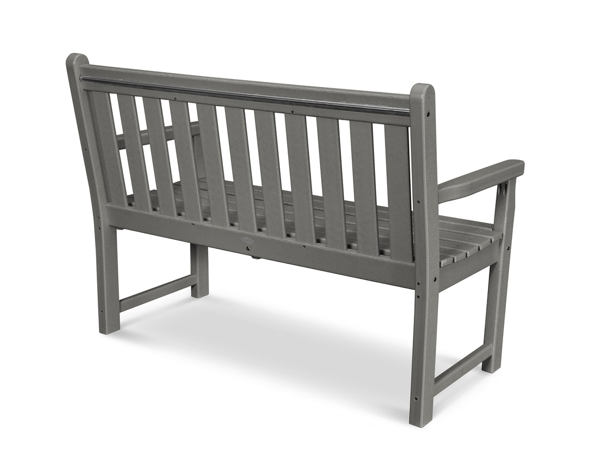 Angled view of the POLYWOOD Traditional Garden 48" Bench in Slate Grey
