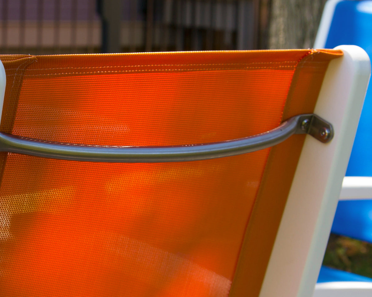 Close-up of an orange sling and the stainless steel support bar on the POLYWOOD Coastal Folding Chair