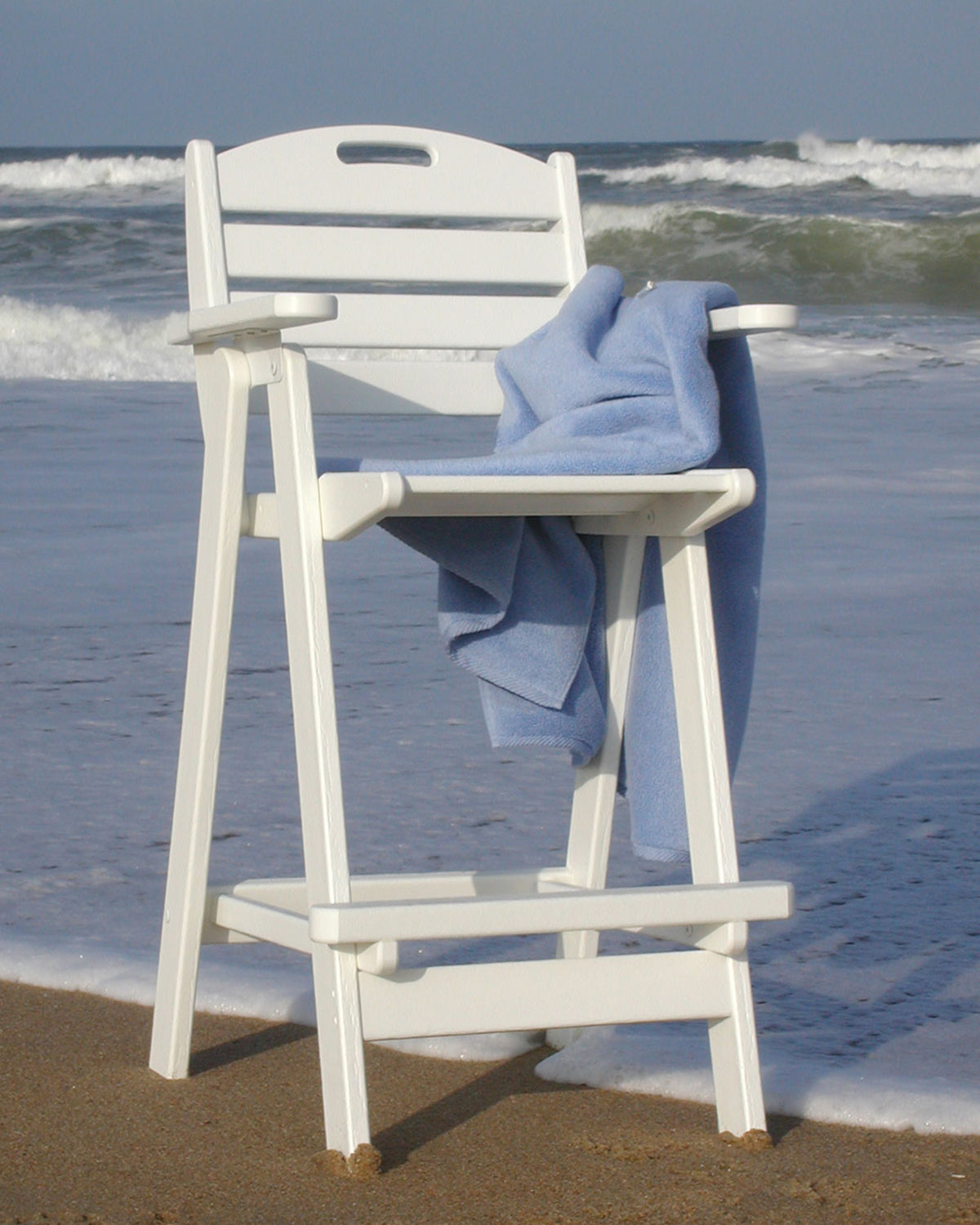 Lifestyle photo of the POLYWOOD Nautical Bar Chair in White
