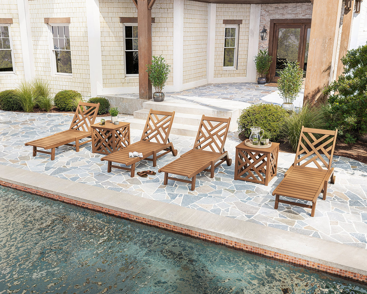 POLYWOOD Chippendale 6-Piece Chaise Set with Wheels and Umbrella Stand Accent Table in an outdoor setting