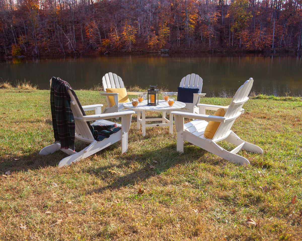 POLYWOOD Classic Oversized Folding Adirondack Chair in White in an outdoor setting