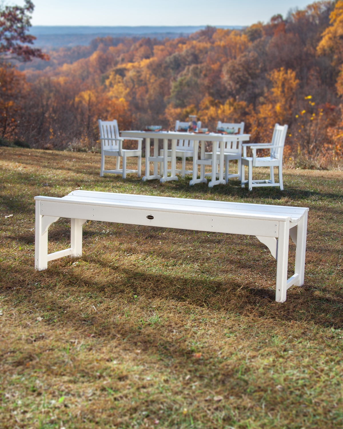 POLYWOOD Traditional Garden 60" Backless Bench in White in an outdoor setting