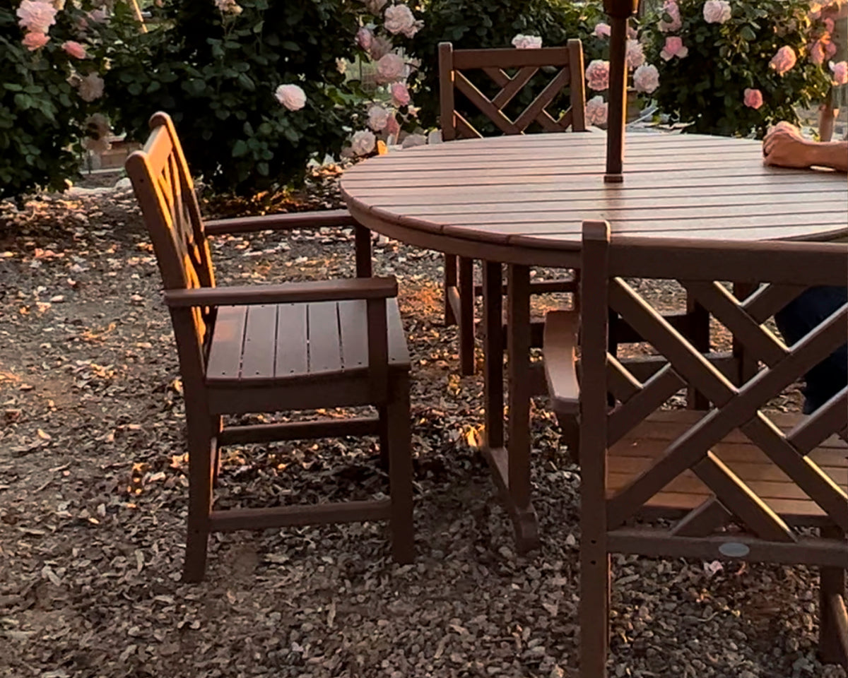 POLYWOOD Chippendale 5-Piece Round Farmhouse Dining Set in Teak in an outdoor setting