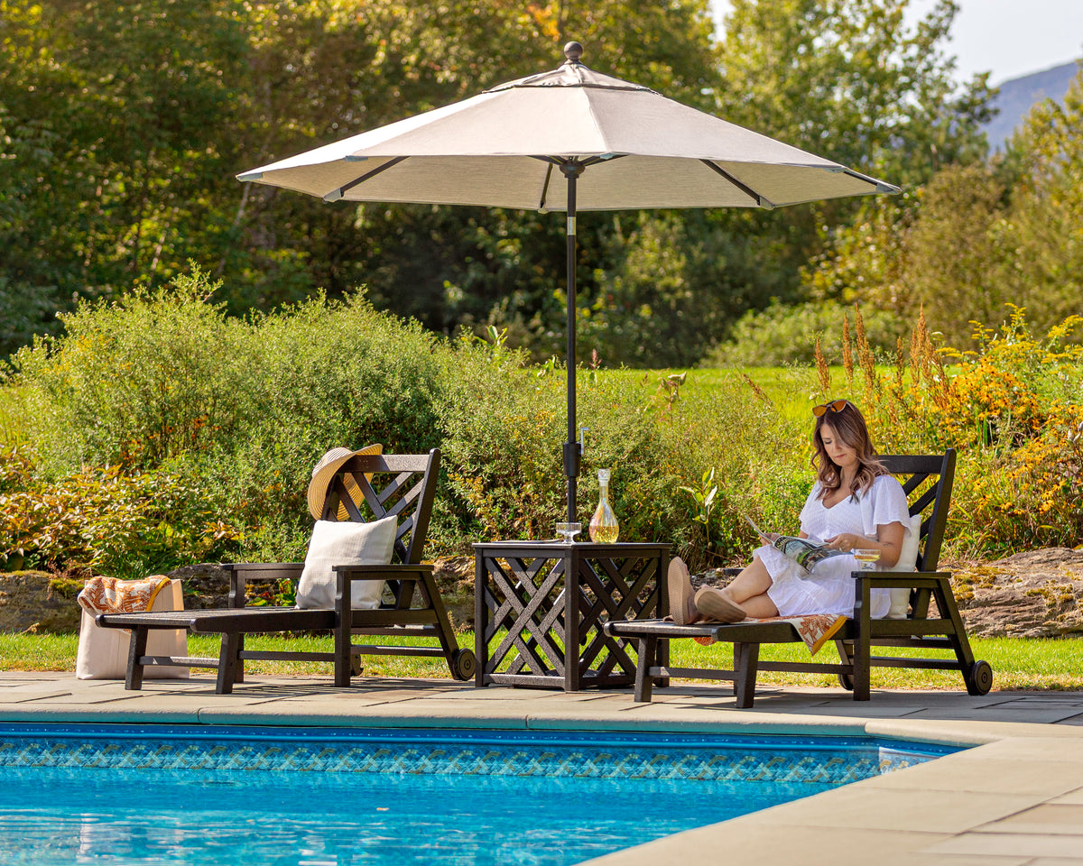 POLYWOOD Chippendale 3-Piece Chaise Set with Umbrella Stand Accent Table in an outdoor setting