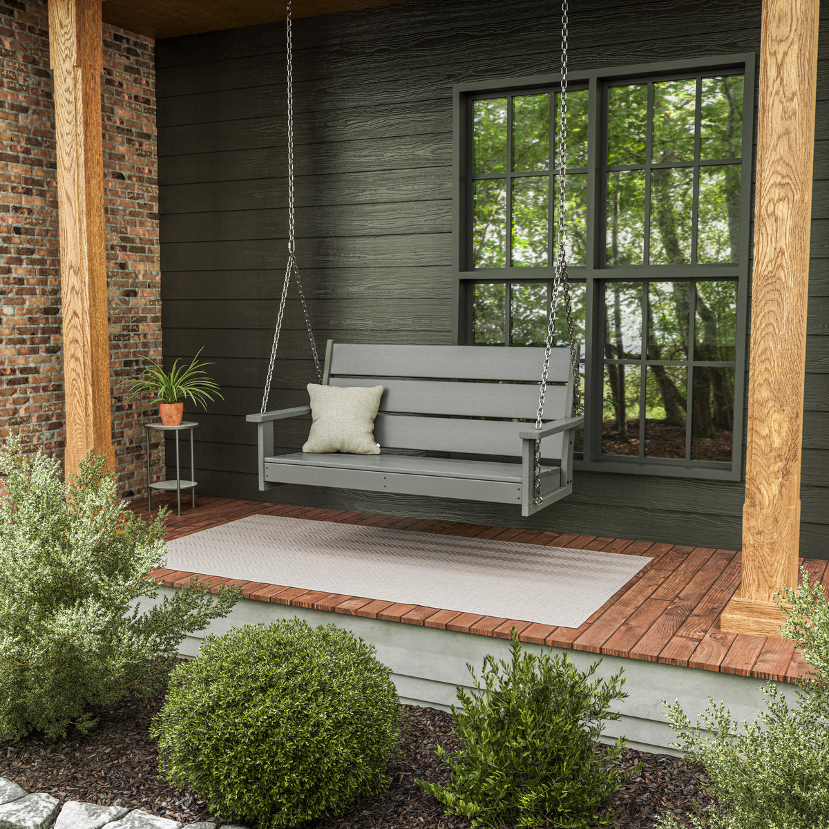 Lifestyle photo of the POLYWOOD Lakeside 48" Swing in Slate Grey