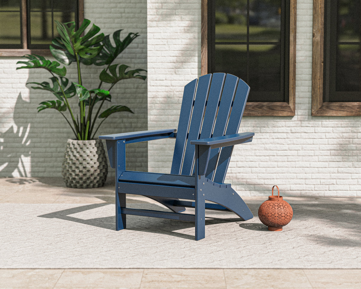 Lifestyle photo of the POLYWOOD Nautical Adirondack Chair in Navy