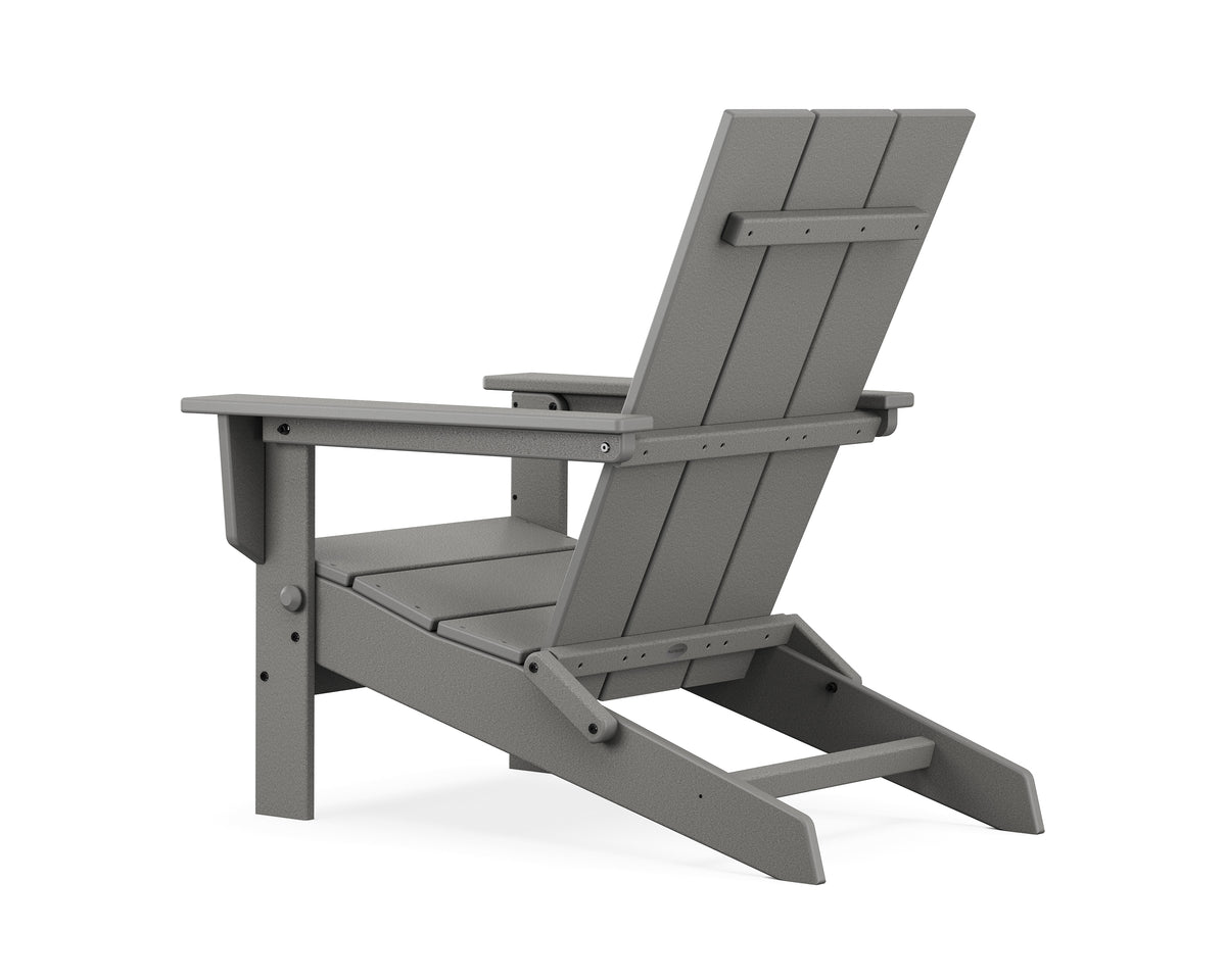 Angled view of the POLYWOOD Modern Studio Folding Adirondack Chair in Slate Grey