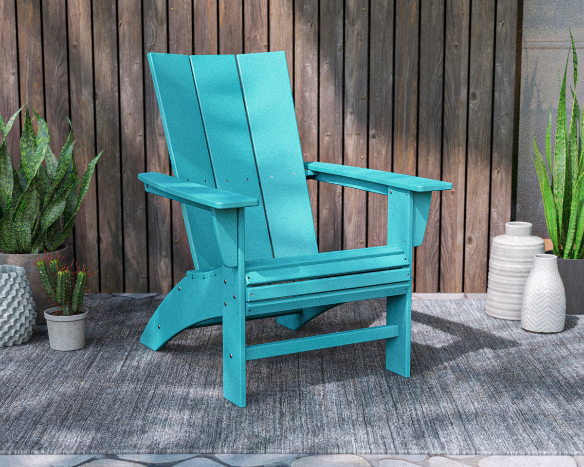 POLYWOOD Modern Curveback Adirondack Chair in Aruba in an outdoor setting