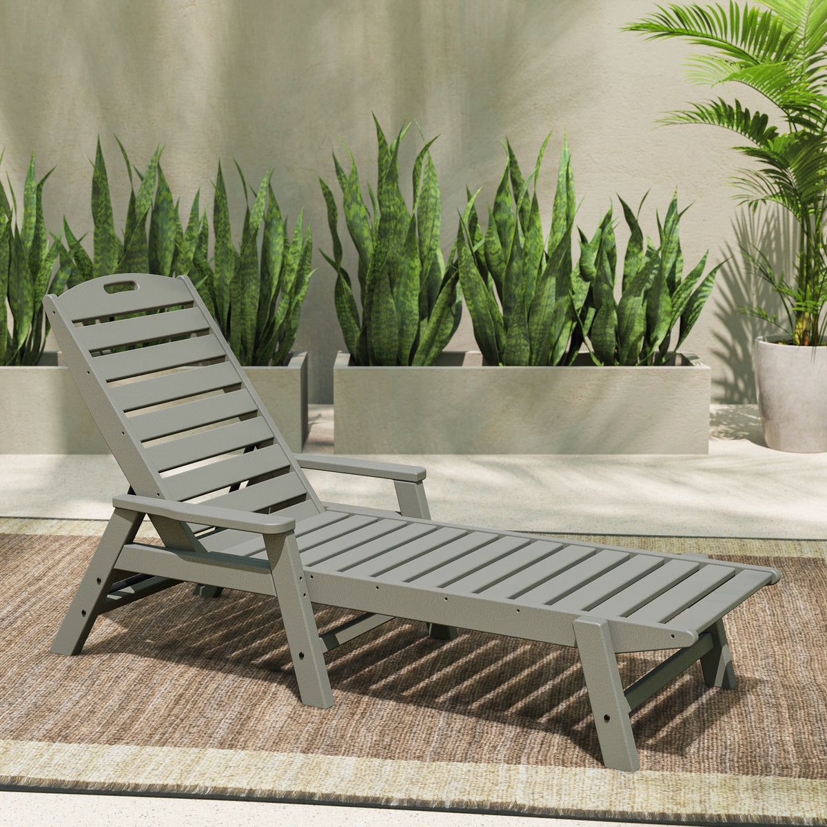 POLYWOOD Nautical Chaise with Arms in Slate Grey in an outdoor setting