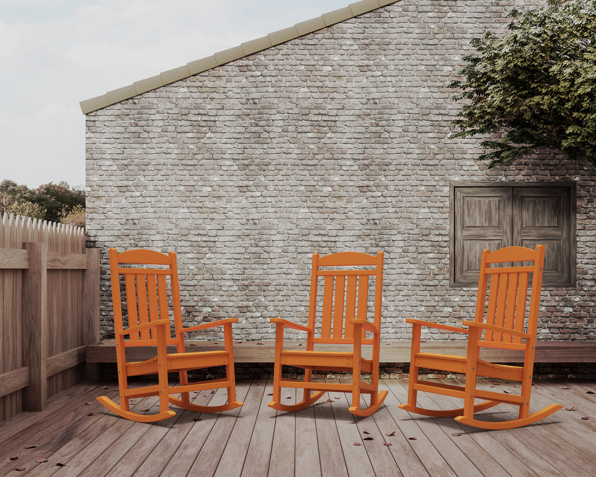POLYWOOD Presidential Rocking Chair in Tangerine in an outdoor setting