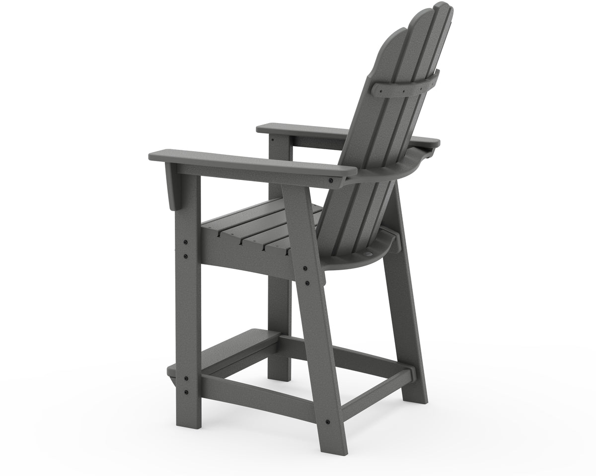 Angled view of the POLYWOOD Vineyard Curveback Adirondack Counter Chair in Slate Grey