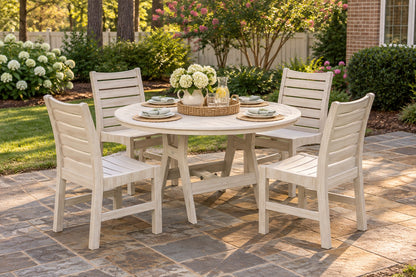Berlin Gardens Bristol 48" Round Dining Set with Harbor Table &amp; 4 Bristol Dining Chairs on a backyard patio