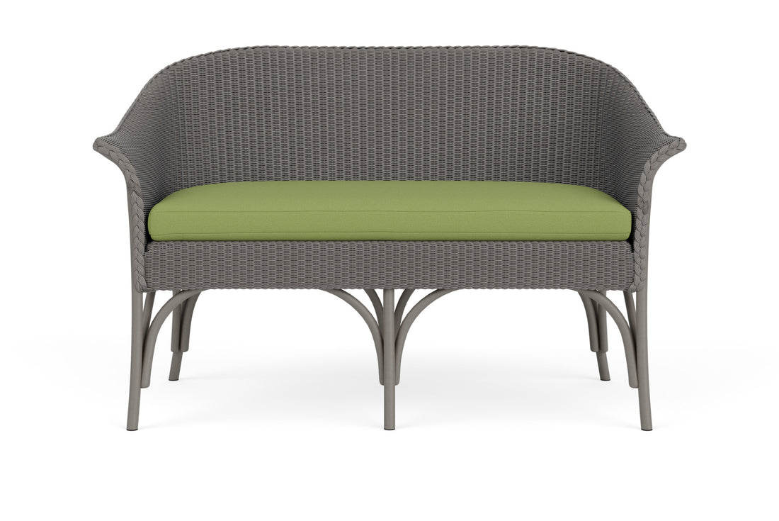 Lloyd Flanders All Seasons Settee in Pewter frame with Brightside Apple fabric