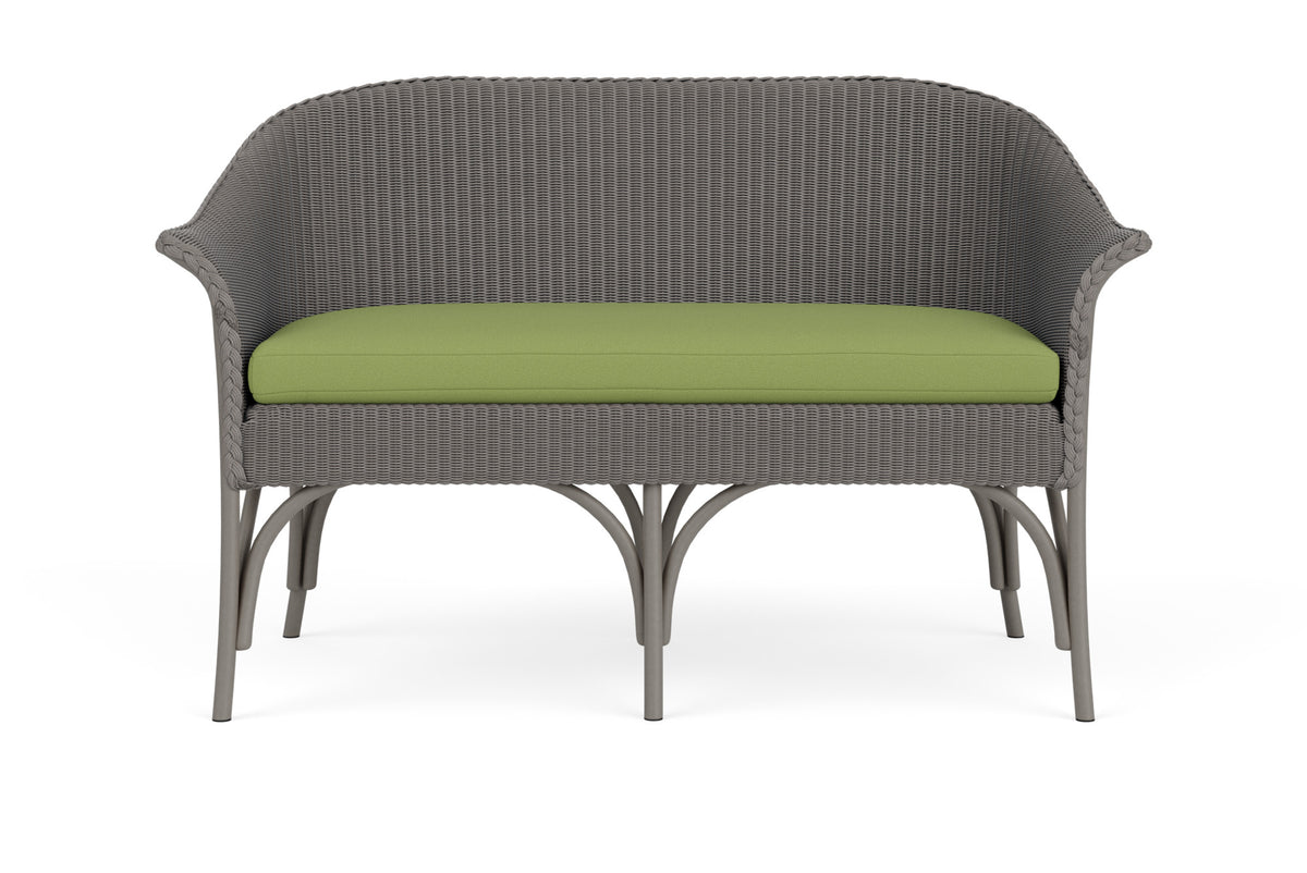Lloyd Flanders All Seasons Settee in Pewter frame with Brightside Apple fabric