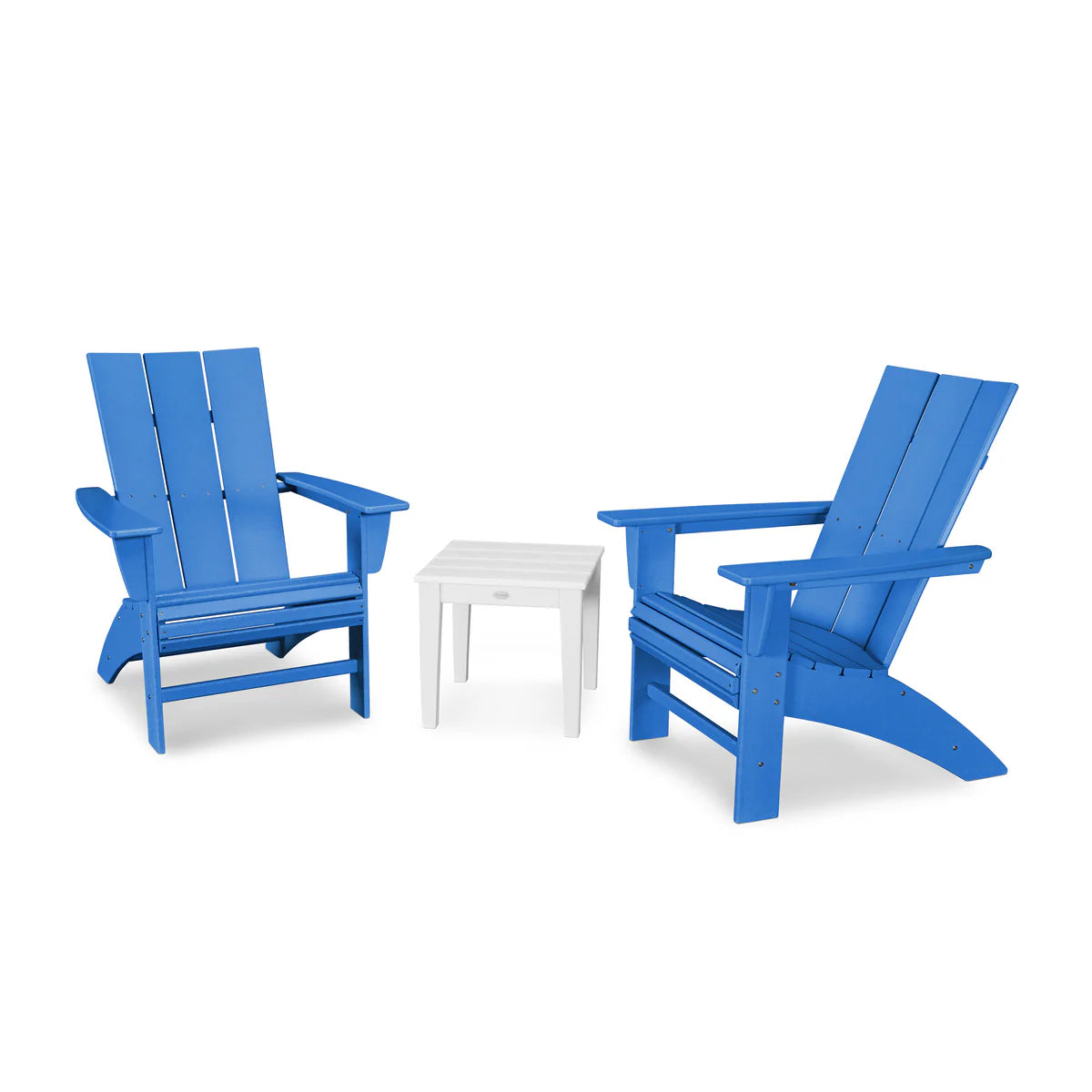 Two blue Adirondack chairs with a white table on a white background