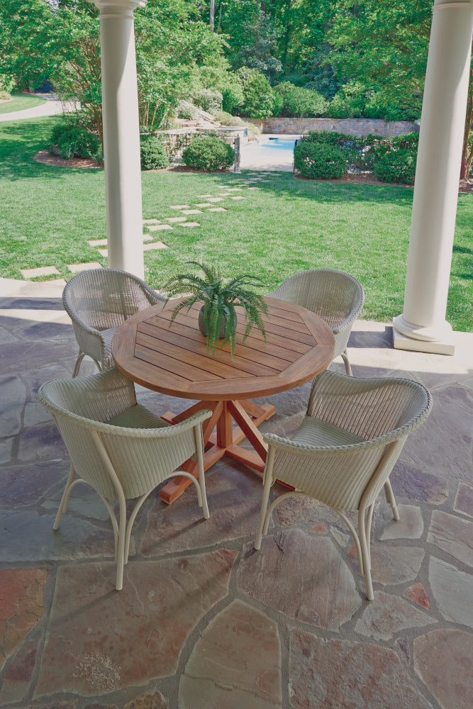 Lloyd Flanders Teak 48" Round Cross Base Dining Table, lifestyle photo 4