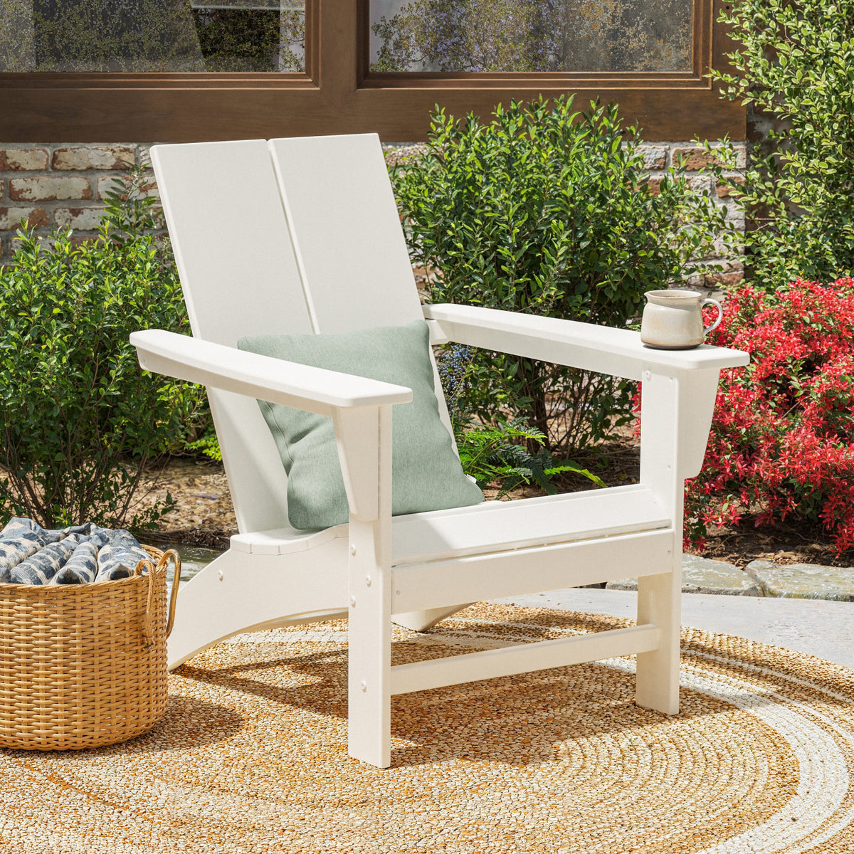 Lifestyle photo of the POLYWOOD Cottage Modern Adirondack Chair in White